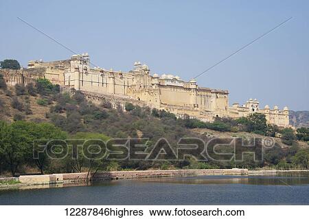 Stock Photograph - Amber Fort viewed from across the lake; Jaipur, Rajasthan state, India. Fotosearch