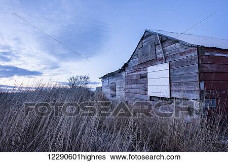 Stock Photograph - An old shed sits in twilight at the village of Igiugig, Alaska, at the headwaters of the Kvichak River.. Fotosearch