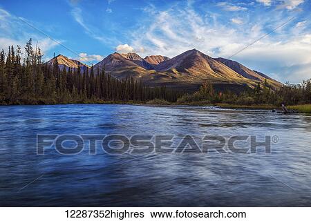 An unnamed peak along the Lapie River along the South Canol Road; Yukon, Canada View Large Photo Image Stock Photograph - An unnamed peak along the Lapie River along the South Canol Road; Yukon, Canada. Fotosearch