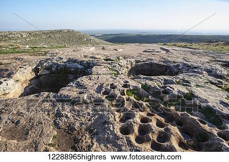 Stock Photograph - Ancient ruins of the oldest civilization; Gobekli Tepe, Turkey. Fotosearch