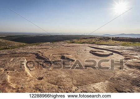 Stock Photograph - Ancient ruins of the oldest civilization; Gobekli Tepe, Turkey. Fotosearch