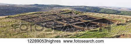 Stock Photograph - Ancient ruins of the oldest civilization on a neolithic hilltop; Gobekli Tepe, Turkey. Fotosearch