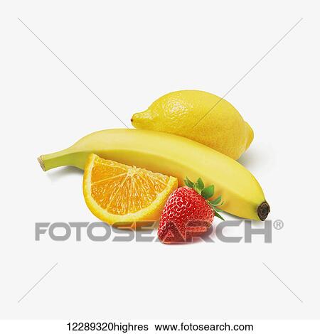 Stock Photograph - Assortment of fruit on a white background; Toronto, Ontario, Canada. Fotosearch