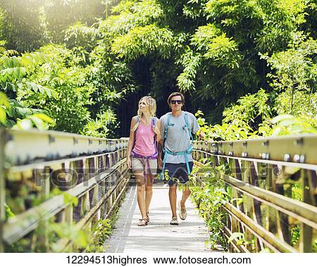Attractive young couple having fun together outdoors on hike View Large Photo Image Stock Photograph - Attractive young couple having fun together outdoors on hike. Fotosearch