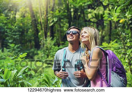 Attractive young couple having fun together outdoors on hike View Large Photo Image Stock Photograph - Attractive young couple having fun together outdoors on hike. Fotosearch