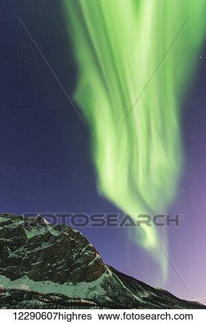 Aurora borealis display over Mt. Sukakpak in the Brooks Range near Wiseman, Alaska. View Large Photo Image Stock Photograph - Aurora borealis display over Mt. Sukakpak in the Brooks Range near Wiseman, Alaska.. Fotosearch