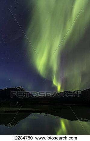 Stock Image - Aurora Borealis, Northern Lights, Mendenhall Lake, Tongass National Forest; Alaska, United States of America. Fotosearch