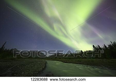 Stock Photo - Aurora Borealis over Quill Creek; Yukon, Canada. Fotosearch