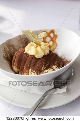Authentic italian cuisine, fresh tiramisu dessert served at a restaurant in Italy; Bellagio, Lombardy, Italy View Large Photo Image Stock Photograph - Authentic italian cuisine, fresh tiramisu dessert served at a restaurant in Italy; Bellagio, Lombardy, Italy. Fotosearch