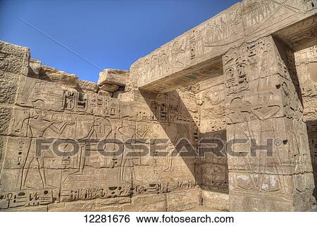 Stock Photograph - Bas reliefs, Hypostyle Hall, Medinet Habu (Mortuary Temple of Ramses III), West Bank; Luxor, Egypt. Fotosearch