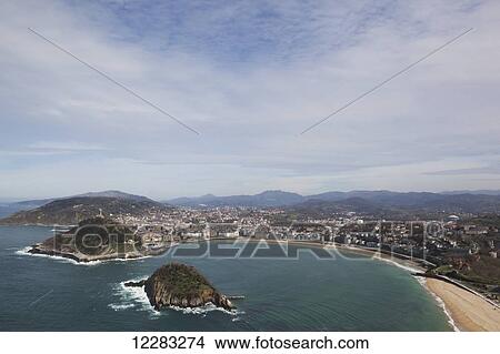 Bay of La Concha beach and the island of Santa Clara; San Sebastian, Spain View Large Photo Image Picture - Bay of La Concha beach and the island of Santa Clara; San Sebastian, Spain. Fotosearch