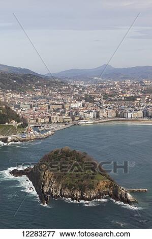 Bay of La Concha beach and the Island of Santa Clara; San Sebastian, Spain View Large Photo Image Stock Photo - Bay of La Concha beach and the Island of Santa Clara; San Sebastian, Spain. Fotosearch