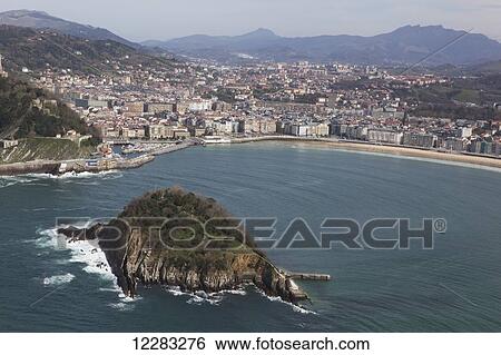 Bay of La Concha beach and the Island of Santa Clara; San Sebastian, Spain View Large Photo Image Stock Photograph - Bay of La Concha beach and the Island of Santa Clara; San Sebastian, Spain. Fotosearch