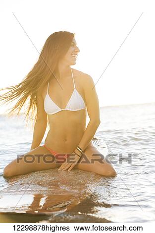 beautiful sexy young woman surfer girl waiting for a wave at sunset View Large Photo Image Stock Photograph - beautiful sexy young woman surfer girl waiting for a wave at sunset. Fotosearch