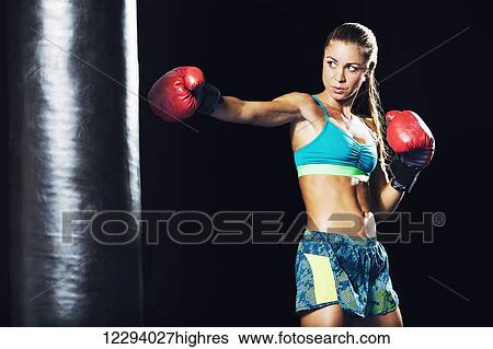 Beautiful Woman with the Red Boxing Gloves. Attractive Female Boxer Training. View Large Photo Image Stock Photograph - Beautiful Woman with the Red Boxing Gloves. Attractive Female Boxer Training.. Fotosearch