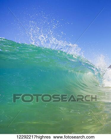 Stock Photograph - Breaking Ocean Wave Crashing over Camera. Fotosearch