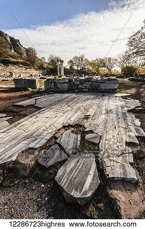 Stock Photograph - Broken ground and columns at a ruins site; Philippi, Greece. Fotosearch