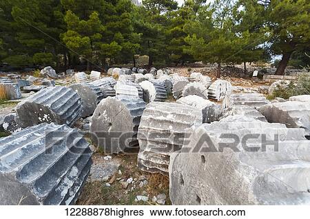 Broken sections of columns at the ruins of the Sanctuary of Athena; Priene, Turkey View Large Photo Image Stock Photograph - Broken sections of columns at the ruins of the Sanctuary of Athena; Priene, Turkey. Fotosearch