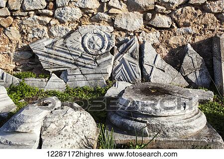 Stock Photograph - Broken stone tablet with cross etched; Philippi, Greece. Fotosearch