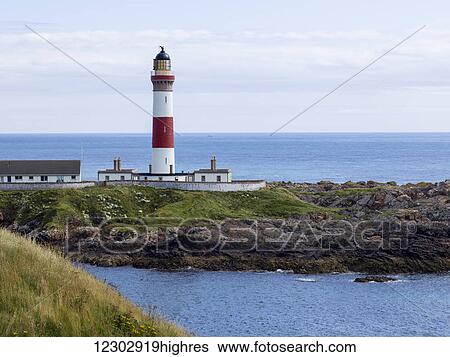 Stock Photograph - Buchan Ness Lighthouse on Moray Firth Coast; Aberdeenshire, Scotland. Fotosearch