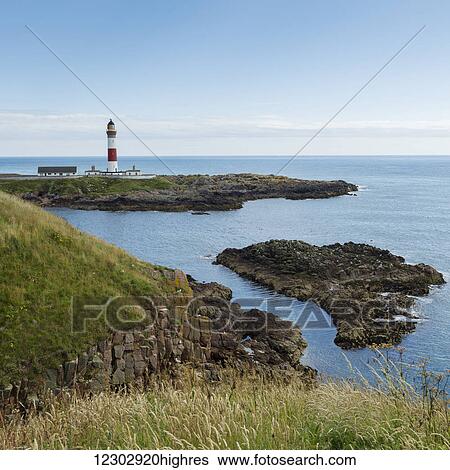 Buchan Ness Lighthouse on Moray Firth Coast; Aberdeenshire, Scotland View Large Photo Image Stock Photograph - Buchan Ness Lighthouse on Moray Firth Coast; Aberdeenshire, Scotland. Fotosearch