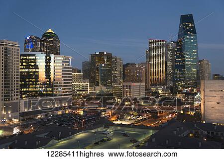 Stock Photograph - Buildings illuminated at dusk; Dallas, Texas, United States of America. Fotosearch