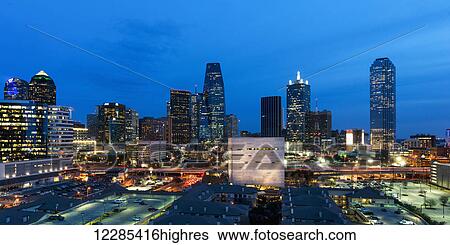 Stock Photograph - Buildings illuminated at dusk; Dallas, Texas, United States of America. Fotosearch