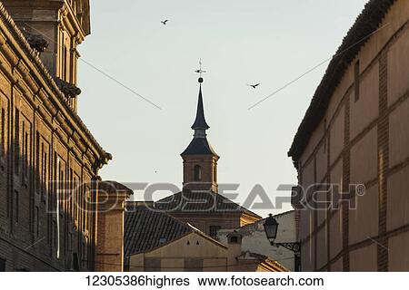 Stock Photograph - Buildings in downtown Alcala de Henares, a historical and charming city near to Madrid; Alcala de Henares, Spain. Fotosearch