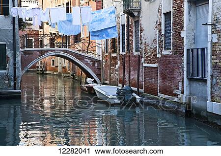 Buildings reflected in the tranquil canal water; Venice, Italy View Large Photo Image Stock Image - Buildings reflected in the tranquil canal water; Venice, Italy. Fotosearch