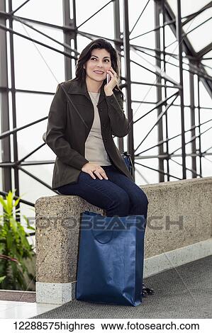 Business woman taking a shopping break during her work day; Edmonton, Alberta, Canada View Large Photo Image Stock Photograph - Business woman taking a shopping break during her work day; Edmonton, Alberta, Canada. Fotosearch