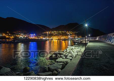 Stock Photograph - Cala Gonone at night; Cala Gonone, Sardinia, Italy. Fotosearch