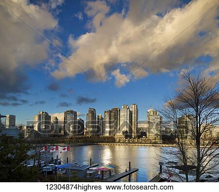 Canada flags and residential buildings along the waterfront, Granville Island; Vancouver, British Columbia, Canada View Large Photo Image Stock Photograph - Canada flags and residential buildings along the waterfront, Granville Island; Vancouver, British Columbia, Canada. Fotosearch