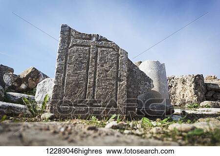 Stock Photograph - Carved cross into stone ruins; Loadicea, Turkey. Fotosearch