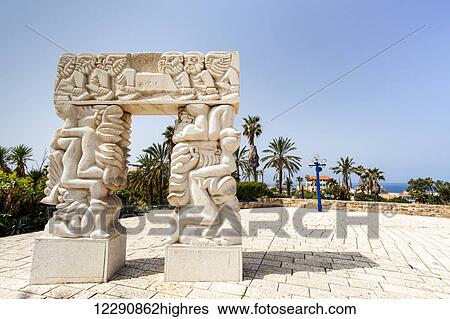 Stock Photograph - Carved white stone structure with images of human figures; Joppa, Israel. Fotosearch