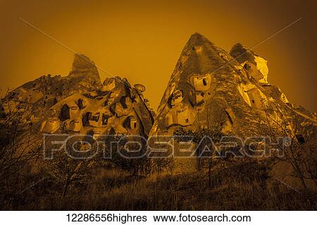 Cave homes in rock formations and fairy chimneys; Goreme, Cappadocia, Turkey View Large Photo Image Stock Photograph - Cave homes in rock formations and fairy chimneys; Goreme, Cappadocia, Turkey. Fotosearch