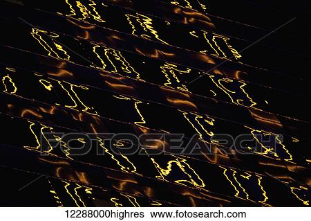 Stock Photograph - Central Plaza light reflections in abstract pattern; Hong Kong, China. Fotosearch