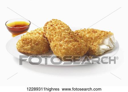 Chicken pieces with a bowl of dipping sauce on a white background; Toronto, Ontario, Canada View Large Photo Image Stock Photograph - Chicken pieces with a bowl of dipping sauce on a white background; Toronto, Ontario, Canada. Fotosearch