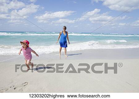 Child running and crying on the beach with her mother; Varadero, Cuba View Large Photo Image Stock Photograph - Child running and crying on the beach with her mother; Varadero, Cuba. Fotosearch