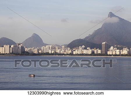 Stock Photograph - Christ the Redeemer Statue overlooking Flamengo; Rio de Janeiro, Brazil. Fotosearch