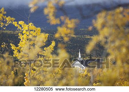 Stock Photography - Christian Church steeple through Fall Aspen leaves near the Matanuska Glacier, Glenn Highway. Fotosearch