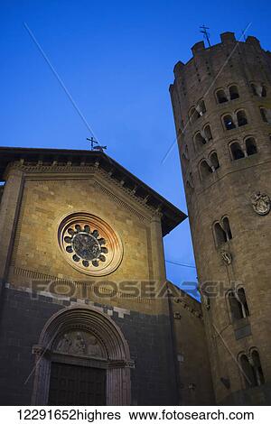 Stock Photograph - Church building and round tower; Orvieto, Umbria, Italy. Fotosearch