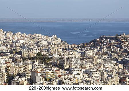 Stock Photograph - Cityscape and harbour of Kavala; Kavala, Greece. Fotosearch