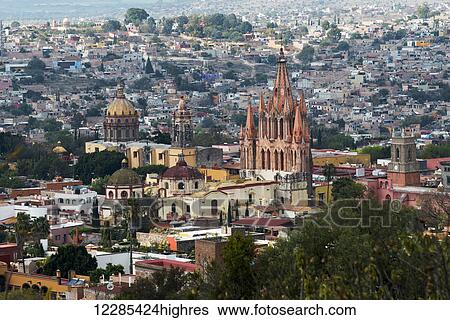 Cityscape with church building rising above other buildings; San Miguel de Allende, Guanajuato, Mexico View Large Photo Image Stock Photograph - Cityscape with church building rising above other buildings; San Miguel de Allende, Guanajuato, Mexico. Fotosearch