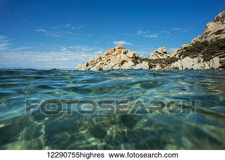 Stock Photograph - Clear waters in Valle della Luna; Santa Teresa, Sardinia, Italy. Fotosearch