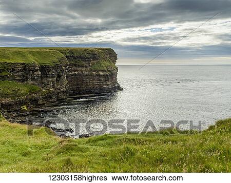 Stock Photograph - Cliffs along the coastline and the North Sea, Duncansby Head; John O'Groats, Scotland. Fotosearch