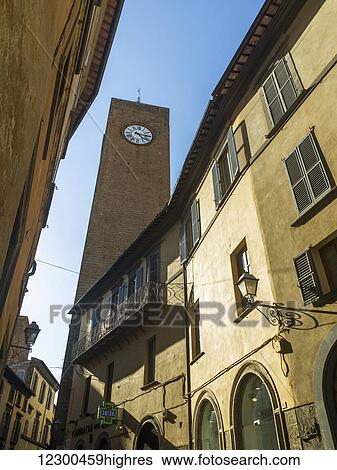 Clock tower against a blue sky; Orvieto, Umbria, Italy View Large Photo Image Stock Photograph - Clock tower against a blue sky; Orvieto, Umbria, Italy. Fotosearch