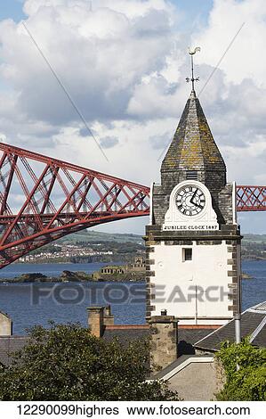 Clock tower and red metal bridge at the waterfront; Edinburgh, Scotland View Large Photo Image Stock Photograph - Clock tower and red metal bridge at the waterfront; Edinburgh, Scotland. Fotosearch