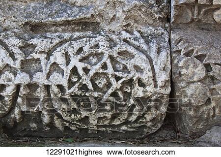 Stock Photograph - Close up detail of the Star of David carved in stone; Capernaum, Israel. Fotosearch