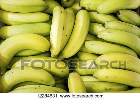 Stock Image - Close up of a box full of bananas at the Tshwane Fresh Produce Market; Pretoria, Gautang, South Africa. Fotosearch