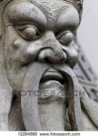 Close up of a carved stone statue in male likeness; Bangkok, Thailand View Large Photo Image Stock Photo - Close up of a carved stone statue in male likeness; Bangkok, Thailand. Fotosearch